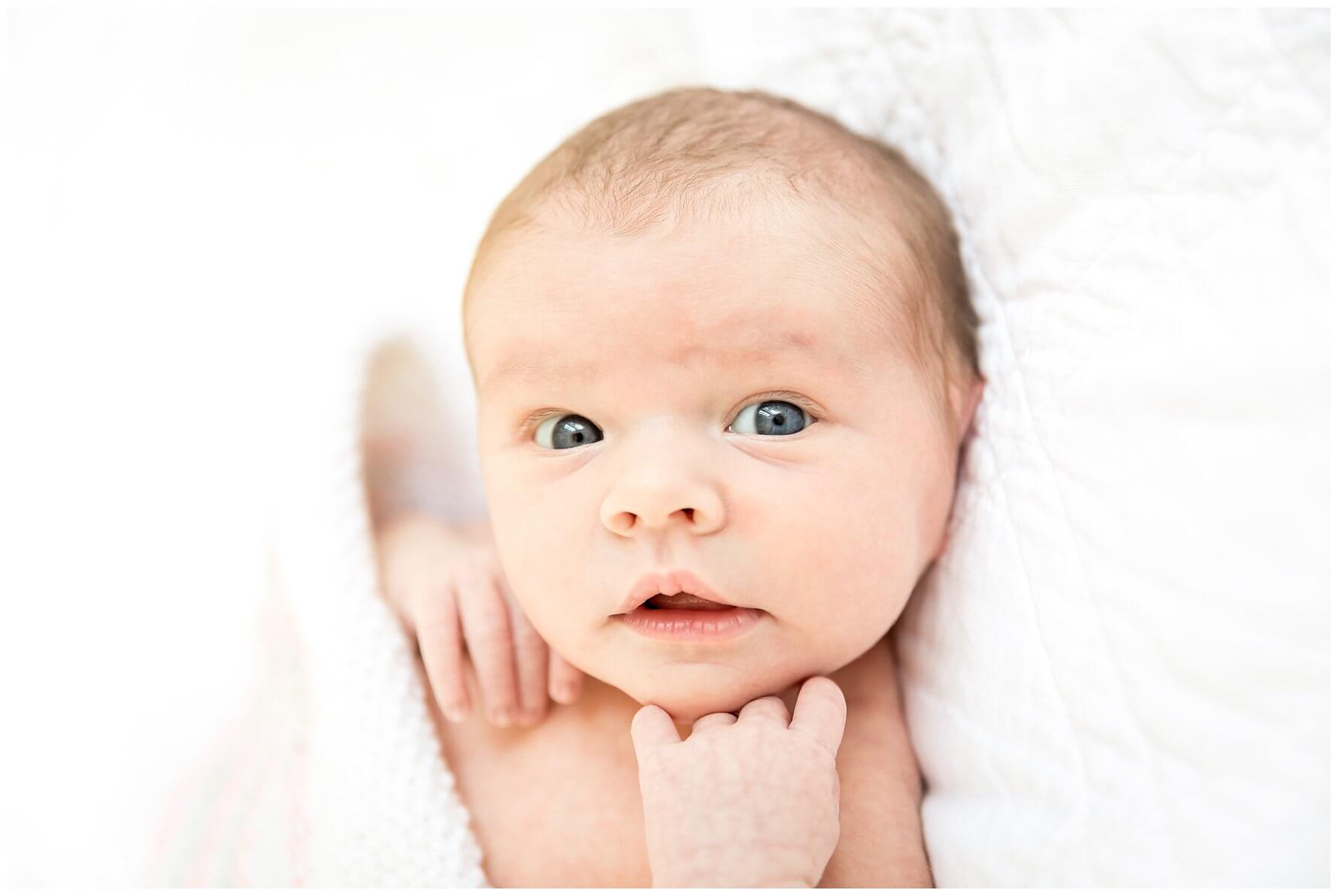 newborn baby girl with blue eyes
